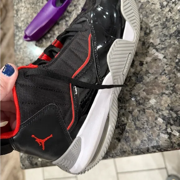 Air Jordan Youth high top tennis shoe.