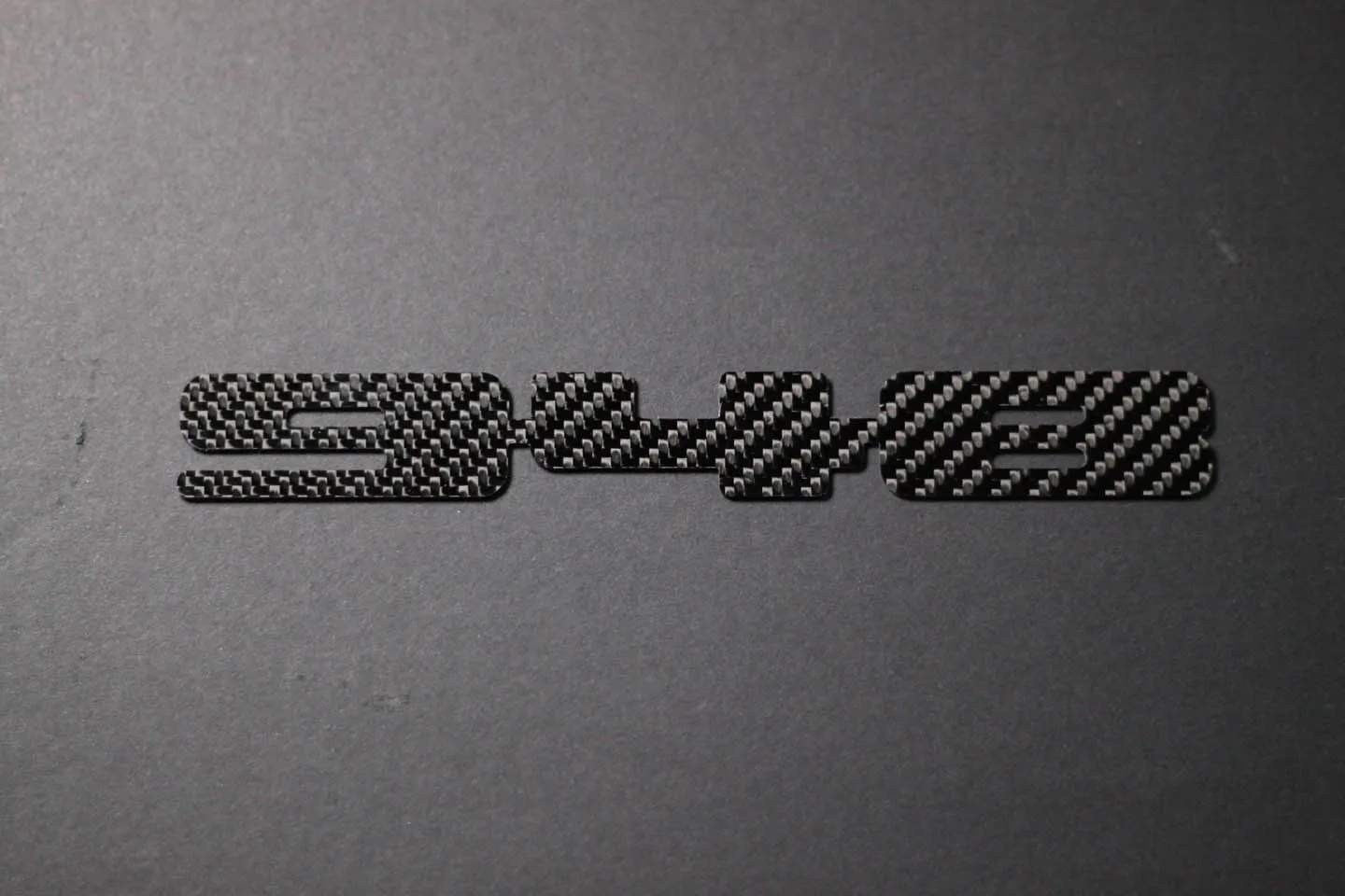 Carbon fiber "948" badge