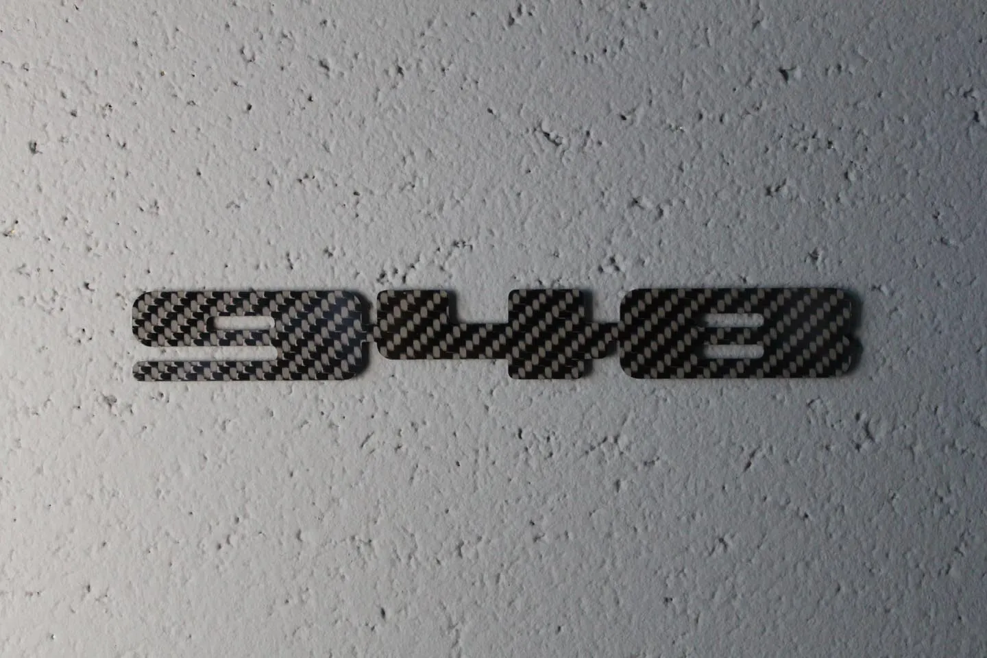 Carbon fiber "948" badge